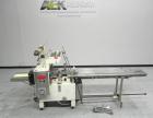Used Doboy Model Scotty II Horizontal Flow Wrapper. Machine is capable of speeds up to 60 packages per minute. Has 6' Long lugged Carrier Style chain infeed on 12” centers. Package size range: (lengt...