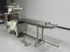 Used Doboy Model Scotty II Horizontal Flow Wrapper. Machine is capable of speeds up to 60 packages per minute. Has 6' Long lugged Carrier Style chain infeed on 12” centers. Package size range: (lengt...