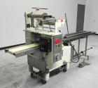 Used Doboy Model Scotty II Horizontal Flow Wrapper. Machine is capable of speeds up to 60 packages per minute. Has 6' Long lugged Carrier Style chain infeed on 12” centers. Package size range: (lengt...
