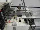 Used Doboy Model Scotty II Horizontal Flow Wrapper. Machine is capable of speeds up to 60 packages per minute. Has 6' Long lugged Carrier Style chain infeed on 12” centers. Package size range: (lengt...
