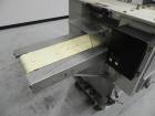 Used Doboy Model Scotty II Horizontal Flow Wrapper. Machine is capable of speeds up to 60 packages per minute. Has 6' Long lugged Carrier Style chain infeed on 12” centers. Package size range: (lengt...