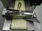 Used Doboy Model Scotty II Horizontal Flow Wrapper. Machine is capable of speeds up to 60 packages per minute. Has 6' Long lugged Carrier Style chain infeed on 12” centers. Package size range: (lengt...
