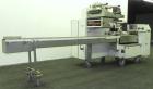 Used FMC Model WM20 SynchroFlo Horizontal Wrapper. Speeds up uo 300 packages per minute. 2 up cutting head, 1 1/2
