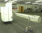Used FMC Model WM20 SynchroFlo Horizontal Wrapper. Speeds up uo 300 packages per minute. 2 up cutting head, 1 1/2