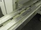 Used FMC Model WM20 SynchroFlo Horizontal Wrapper. Speeds up uo 300 packages per minute. 2 up cutting head, 1 1/2