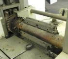 Used FMC Model WM20 SynchroFlo Horizontal Wrapper. Speeds up uo 300 packages per minute. 2 up cutting head, 1 1/2