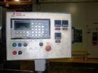 USED: FMC model WS-20 Series II horizontal wrapper. Dual land servo driven. All stainless steel wash down unit. Last ran meat patties.