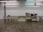 Used FMC Model WSD-20 Automatic Stainless Steel Servo Flo Horizontal Wrapper. Capable of speeds to 150 packages per minute  depending on materials and application. Package size: up to 18