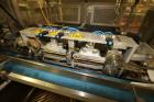 Used-Ilapak Delta 4000 LDR-3SSC Horizontal Flow Wrapper with long dwell and zipper attachment. Has automatic smart belt feed...