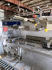 Used- SIG Horizontal Flow Wrapper, Model HBM. Wrapper is rated for speeds from 50 to 350 packages per minute. Has a 7.5