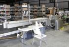 Used System Packaging 9000-18 Cold Seal Packaging Machine with an infeed barcode scanner, quick change pneumatic spindles, top and bottom perforators for easy package opening, Weber 5200 print and ap...