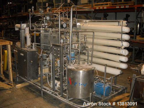 Used APV Crepaco Pasteurizer.Includes an APV plate and frame heat exchanger, model SR15-S, work order #27854. Allen Bradley 1771 P4S power supply.Micro Motion mass flow sensor 1-1/2" inlet and outlet...