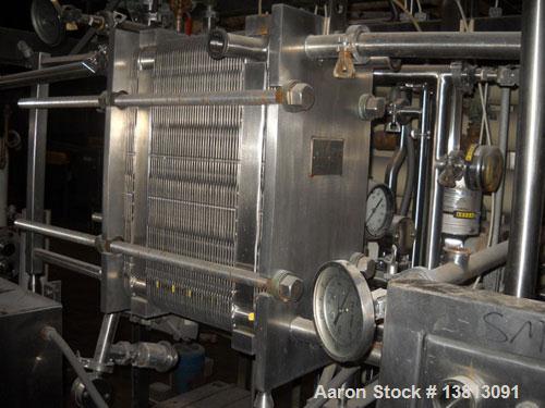 Used APV Crepaco Pasteurizer.Includes an APV plate and frame heat exchanger, model SR15-S, work order #27854. Allen Bradley 1771 P4S power supply.Micro Motion mass flow sensor 1-1/2" inlet and outlet...