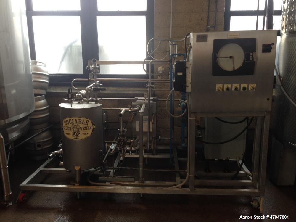Used APV Apple Cider Pasteurizer. Plate and frame heat exchanger, on skid. Model PPAC-05, Apple cider flowrate at 40 degrees F: 5 GPM. Hot water flowrate at 185 degrees F: 10 GPM. 47,000 heating BTUs...
