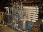 Used APV Crepaco Pasteurizer.Includes an APV plate and frame heat exchanger, model SR15-S, work order #27854. Allen Bradley 1771 P4S power supply.Micro Motion mass flow sensor 1-1/2