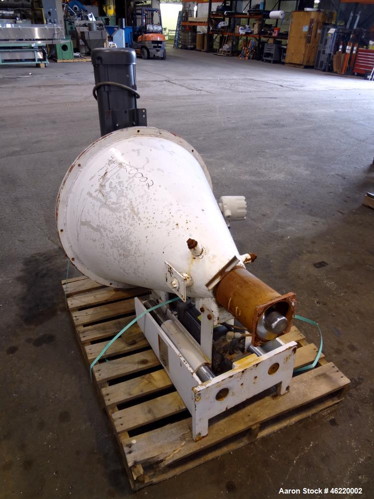 Used Cincinnati Milacron Crammer Feeder. Approximately 5" diameter 304 stainless steel vertical feed screw. Carbon steel slant cone hopper approximately 28" diameter x 34" deep. Screw driven by a 3 h...