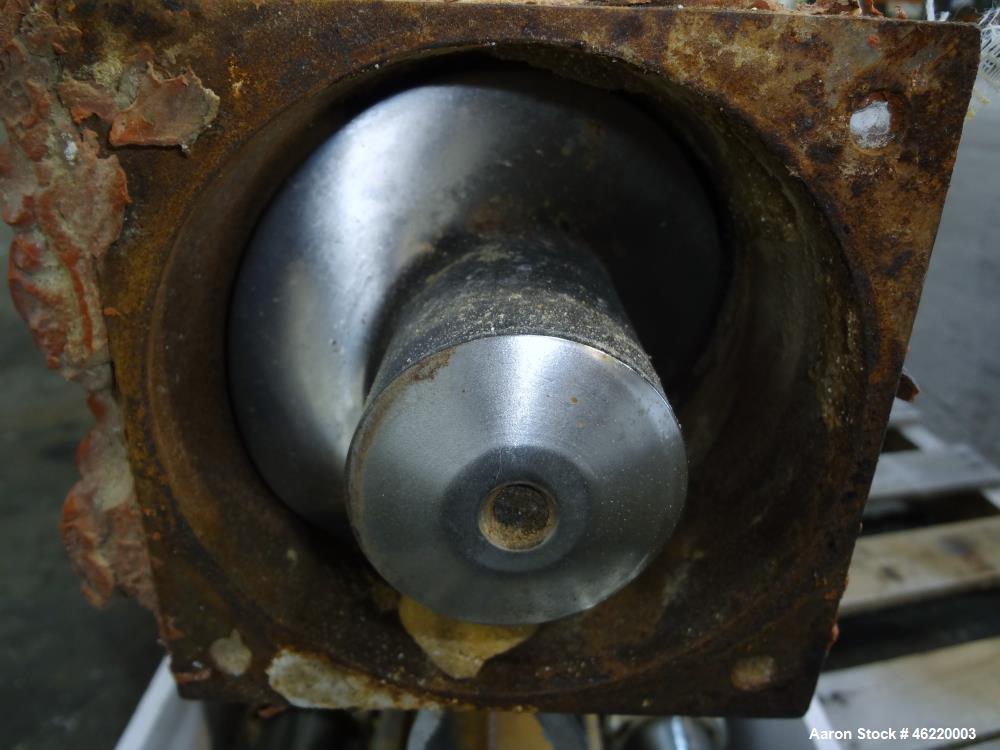 Used Cincinnati Milacron Crammer Feeder. Approximately 5" diameter 304 stainless steel vertical feed screw. Carbon steel slant cone hopper approximately 28" diameter x 34" deep. Screw driven by a 3 h...