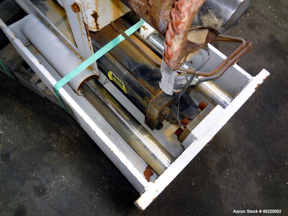 Used Cincinnati Milacron Crammer Feeder. Approximately 5" diameter 304 stainless steel vertical feed screw. Carbon steel slant cone hopper approximately 28" diameter x 34" deep. Screw driven by a 3 h...