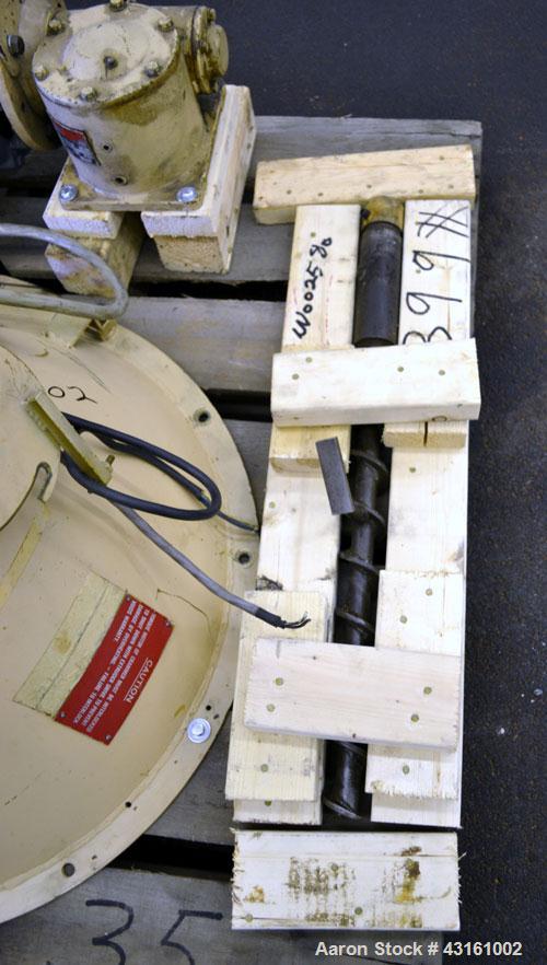 Used Modern Plastics Machinery Crammer Feeder, Carbon Steel. Approximate 30" diameter x 20" deep hopper, 2" diameter screw. Driven by an approximate 2 hp, 3/60/230 volt, 1200 rpm motor thru a reducer...