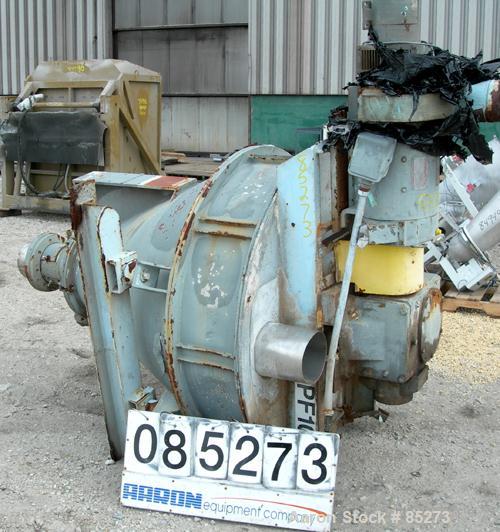 Used Crammer Feeder. 7" diameter feed screw. 48" diameter x 12" straight side x 40" coned 304 stainless steel hopper. Top bolt on cover with openings. Conditioning bar and feed screw driven by a 5 hp...