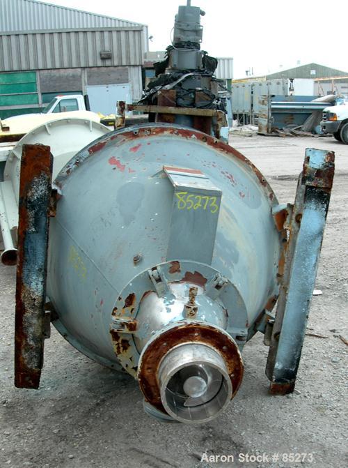 Used Crammer Feeder. 7" diameter feed screw. 48" diameter x 12" straight side x 40" coned 304 stainless steel hopper. Top bolt on cover with openings. Conditioning bar and feed screw driven by a 5 hp...