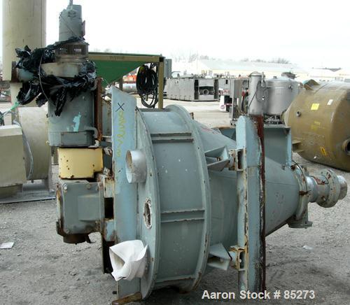 Used Crammer Feeder. 7" diameter feed screw. 48" diameter x 12" straight side x 40" coned 304 stainless steel hopper. Top bolt on cover with openings. Conditioning bar and feed screw driven by a 5 hp...