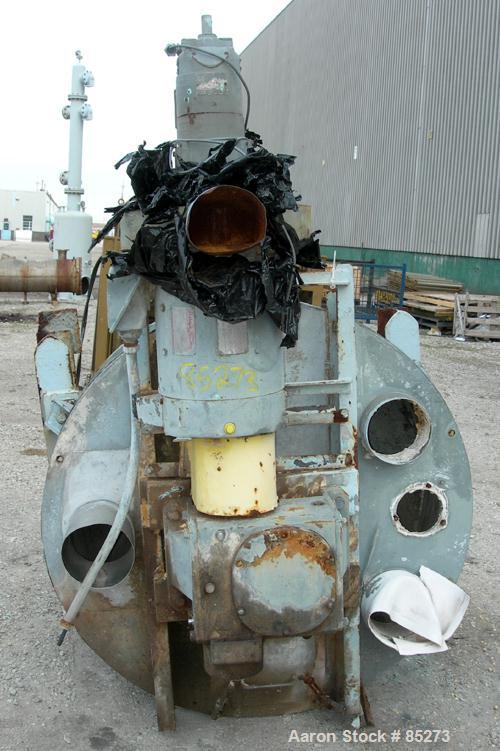 Used Crammer Feeder. 7" diameter feed screw. 48" diameter x 12" straight side x 40" coned 304 stainless steel hopper. Top bolt on cover with openings. Conditioning bar and feed screw driven by a 5 hp...