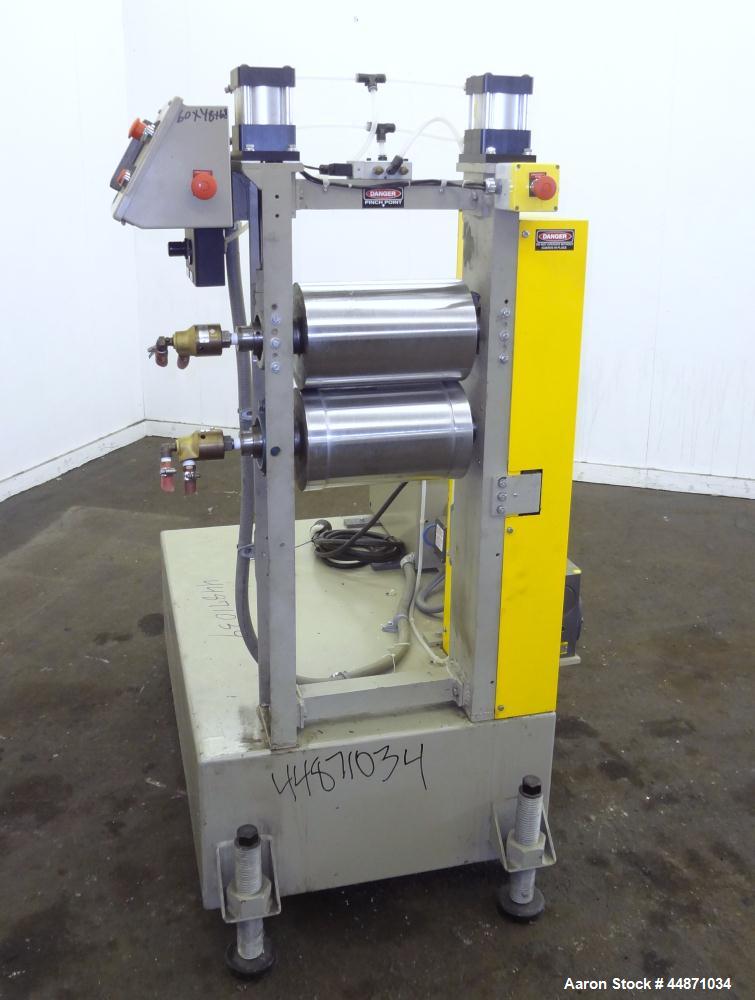 Used Michigan Plastics Machinery Embossing Stand.  (2) Approximately 8" diameter x 12" long cored rolls, pneumatically adjustable.  Driven by a 3/4 hp, 3/60/230/460 volt, 1725 rpm gear motor.  Includ...