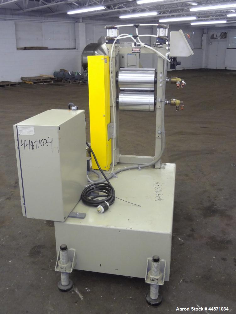 Used Michigan Plastics Machinery Embossing Stand.  (2) Approximately 8" diameter x 12" long cored rolls, pneumatically adjustable.  Driven by a 3/4 hp, 3/60/230/460 volt, 1725 rpm gear motor.  Includ...