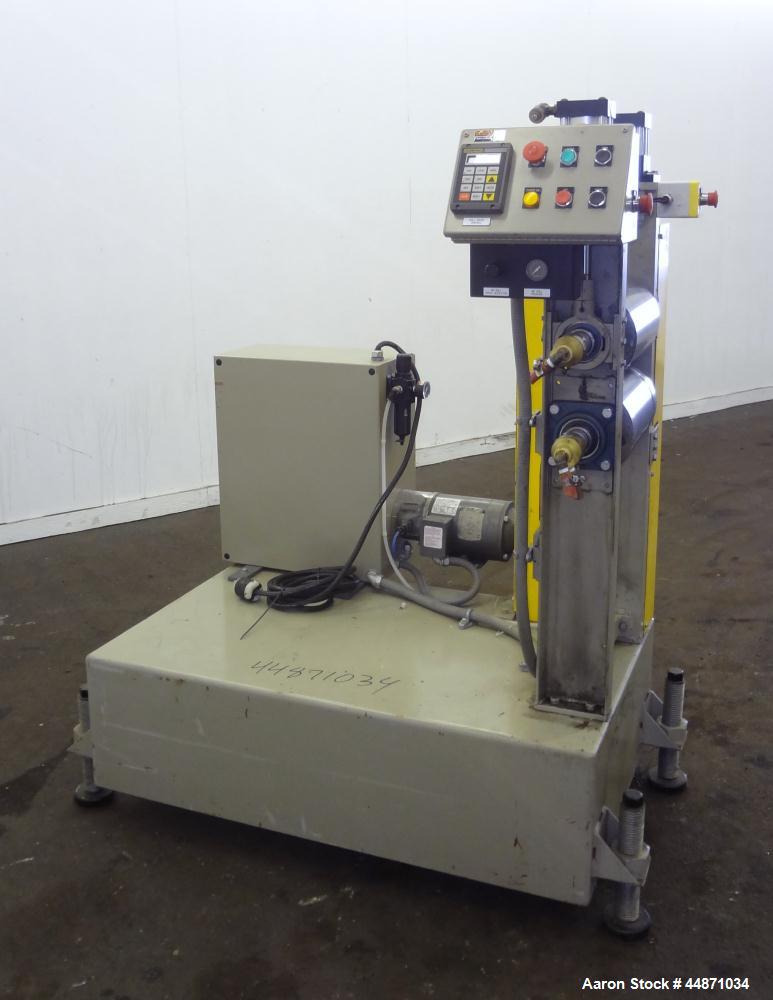 Used Michigan Plastics Machinery Embossing Stand.  (2) Approximately 8" diameter x 12" long cored rolls, pneumatically adjustable.  Driven by a 3/4 hp, 3/60/230/460 volt, 1725 rpm gear motor.  Includ...