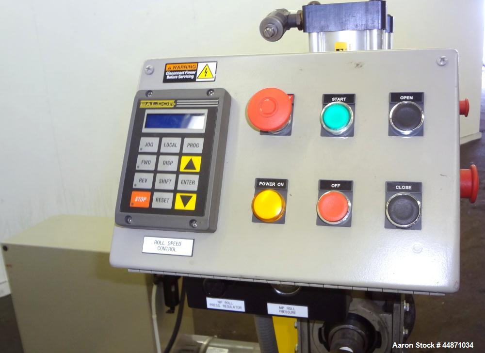 Used Michigan Plastics Machinery Embossing Stand.  (2) Approximately 8" diameter x 12" long cored rolls, pneumatically adjustable.  Driven by a 3/4 hp, 3/60/230/460 volt, 1725 rpm gear motor.  Includ...
