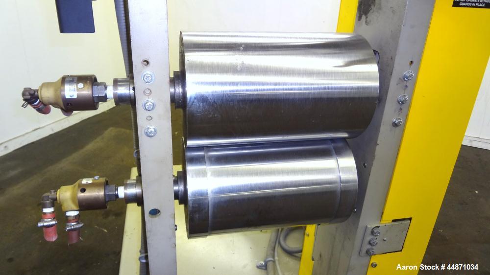 Used Michigan Plastics Machinery Embossing Stand.  (2) Approximately 8" diameter x 12" long cored rolls, pneumatically adjustable.  Driven by a 3/4 hp, 3/60/230/460 volt, 1725 rpm gear motor.  Includ...