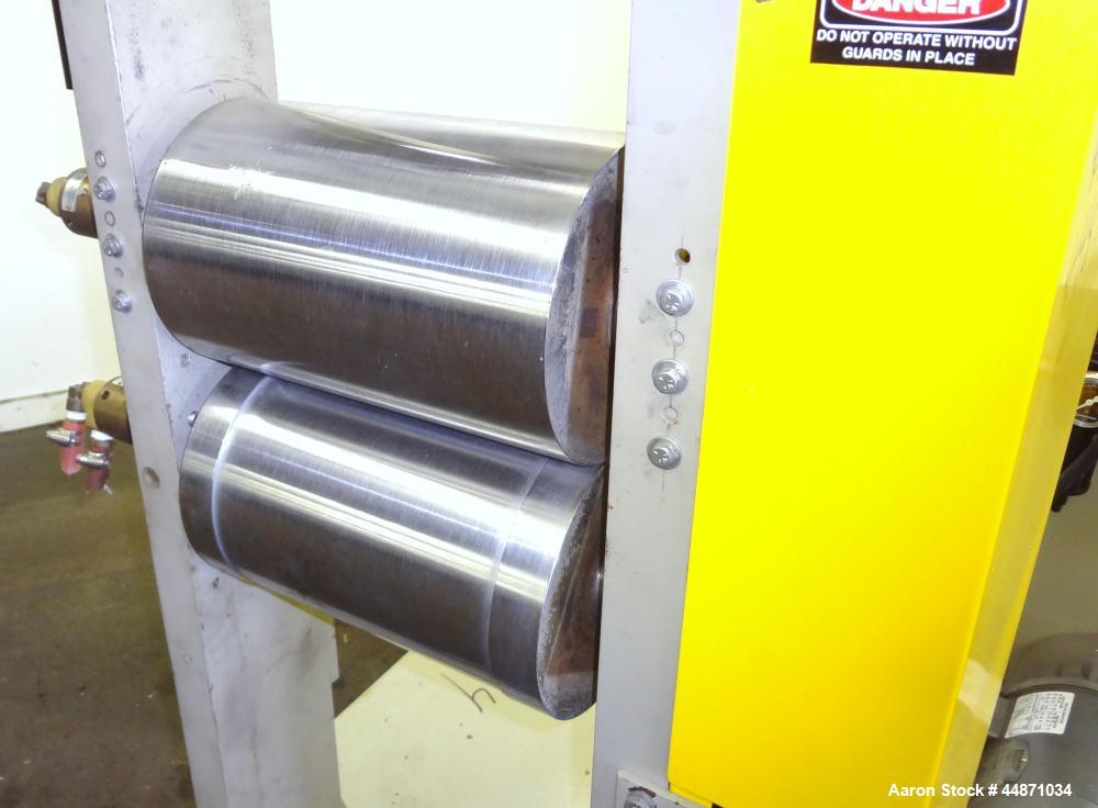 Used Michigan Plastics Machinery Embossing Stand.  (2) Approximately 8" diameter x 12" long cored rolls, pneumatically adjustable.  Driven by a 3/4 hp, 3/60/230/460 volt, 1725 rpm gear motor.  Includ...