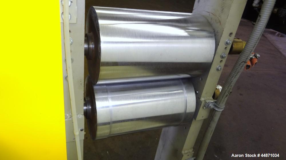Used Michigan Plastics Machinery Embossing Stand.  (2) Approximately 8" diameter x 12" long cored rolls, pneumatically adjustable.  Driven by a 3/4 hp, 3/60/230/460 volt, 1725 rpm gear motor.  Includ...