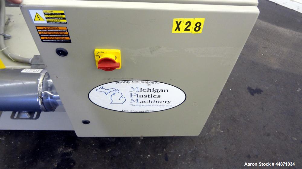 Used Michigan Plastics Machinery Embossing Stand.  (2) Approximately 8" diameter x 12" long cored rolls, pneumatically adjustable.  Driven by a 3/4 hp, 3/60/230/460 volt, 1725 rpm gear motor.  Includ...