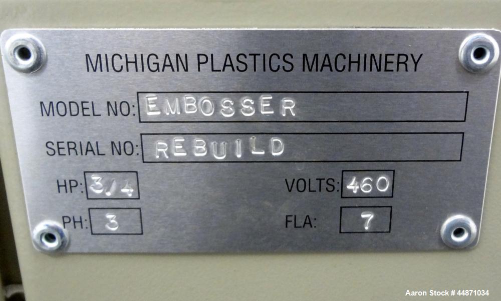 Used Michigan Plastics Machinery Embossing Stand.  (2) Approximately 8" diameter x 12" long cored rolls, pneumatically adjustable.  Driven by a 3/4 hp, 3/60/230/460 volt, 1725 rpm gear motor.  Includ...