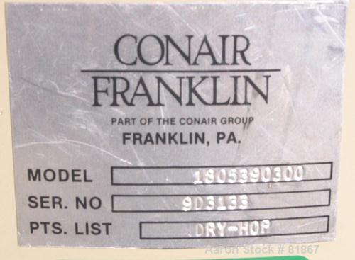 USED: Conair insulated dry hopper, model 1805390300. Approximate 12 cubic foot capacity, carbon steel. 26" diameter x 46" straight side x coned bottom. Side access door. Center bottom outlet. Mounted...
