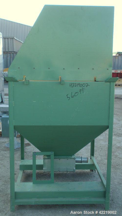 Used NBE Dry Bulk Storage Hopper, approximately 40 cubic feet, carbon steel. 44" wide x 44" long x 18" deep x coned bottom. Approximate 1400 pound capacity. Includes a top extension and grate. Mounte...