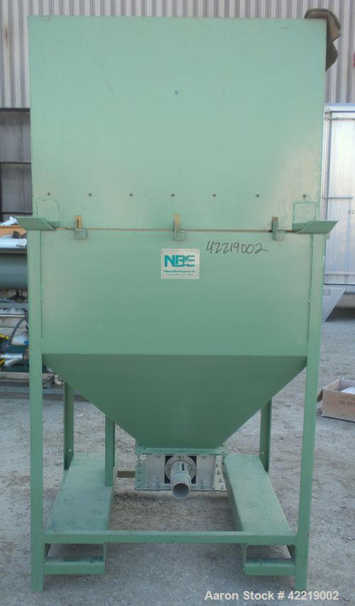 Used NBE Dry Bulk Storage Hopper, approximately 40 cubic feet, carbon steel. 44" wide x 44" long x 18" deep x coned bottom. Approximate 1400 pound capacity. Includes a top extension and grate. Mounte...