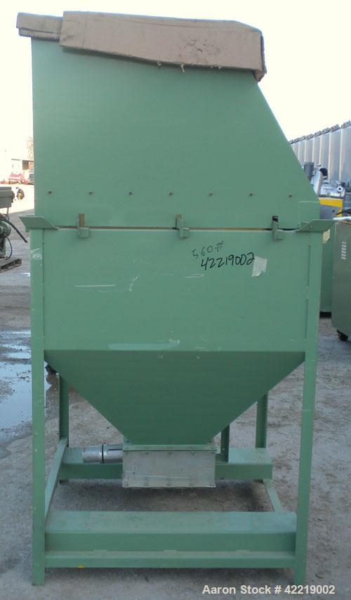 Used NBE Dry Bulk Storage Hopper, approximately 40 cubic feet, carbon steel. 44" wide x 44" long x 18" deep x coned bottom. Approximate 1400 pound capacity. Includes a top extension and grate. Mounte...