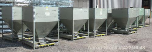 Used NBE Dry Bulk Storage Hopper, approximately 50 cubic feet, carbon steel. 48" wide x 48" long x coned bottom. Approximate 1750 pound capacity. Mounted in a carbon steel frame with forklift access.