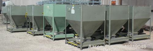 Used NBE Dry Bulk Storage Hopper, approximately 50 cubic feet, carbon steel. 48" wide x 48" long x coned bottom. Approximate 1750 pound capacity. Mounted in a carbon steel frame with forklift access.