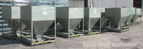 Used NBE Dry Bulk Storage Hopper, approximately 50 cubic feet, carbon steel. 48" wide x 48" long x coned bottom. Approximate 1750 pound capacity. Mounted in a carbon steel frame with forklift access.