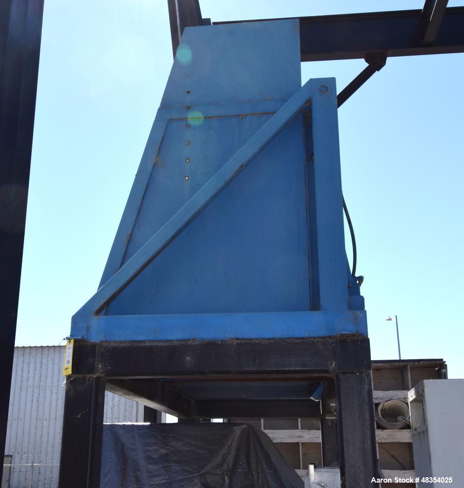 Used Dumpers Unlimited Dual Station Hydraulic Gondola Dumper. (2) Cradles approximate 44" x 44", each with dual ram. Includes a 3hp hydraulic power pack. Mounted on a 79" tall frame.