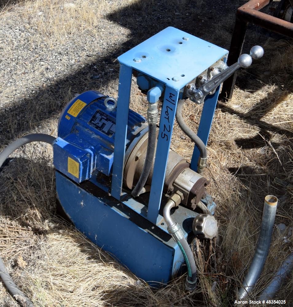 Used Dumpers Unlimited Dual Station Hydraulic Gondola Dumper. (2) Cradles approximate 44" x 44", each with dual ram. Includes a 3hp hydraulic power pack. Mounted on a 79" tall frame.