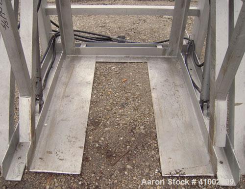 Used Apache Stainless Box Dumper, 304 Stainless Steel. Dump area 42" wide x 49" deep x 54" high. Dual ram, hydraulically driven, no power pack. Approximate 48" dump height. Mounted on a stainless ste...