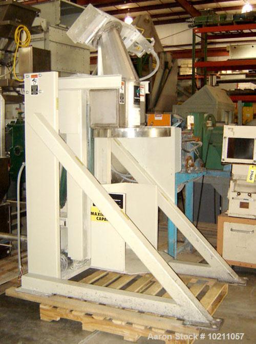Used NBE Lift and Seal Drum Dumper, Stainless Steel Material Contact Parts, Model 19-700.  750 pound capacity unit. Comes complete with controls and power disconnect interface. Material flow is contr...
