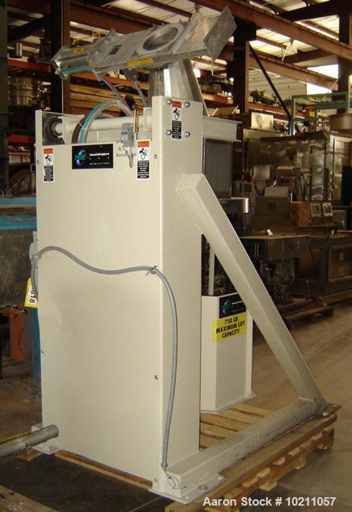 Used NBE Lift and Seal Drum Dumper, Stainless Steel Material Contact Parts, Model 19-700.  750 pound capacity unit. Comes complete with controls and power disconnect interface. Material flow is contr...