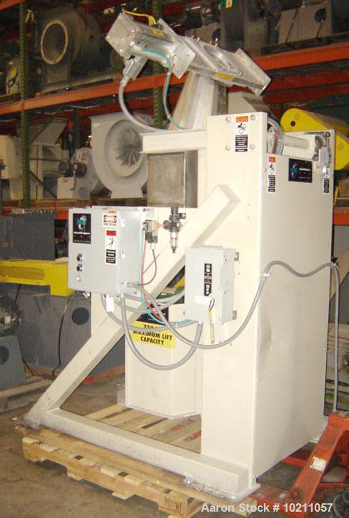 Used NBE Lift and Seal Drum Dumper, Stainless Steel Material Contact Parts, Model 19-700.  750 pound capacity unit. Comes complete with controls and power disconnect interface. Material flow is contr...
