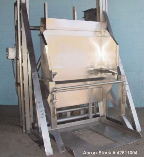 Used RMF Steel Products Hydraulic Box Dumper, model 110, stainless steel. 3,000 Pound capacity. Platform 52" wide X 52" long, maximum tote height 43", dump height approximately 96". Includes a dump c...